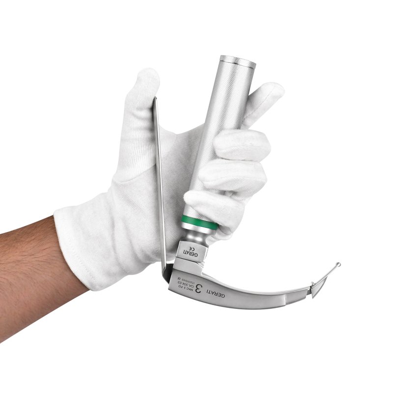 Hand pressing the lever of a GERATI flexible tip laryngoscope, GA 304-03, against the handle so the hinged tip rises